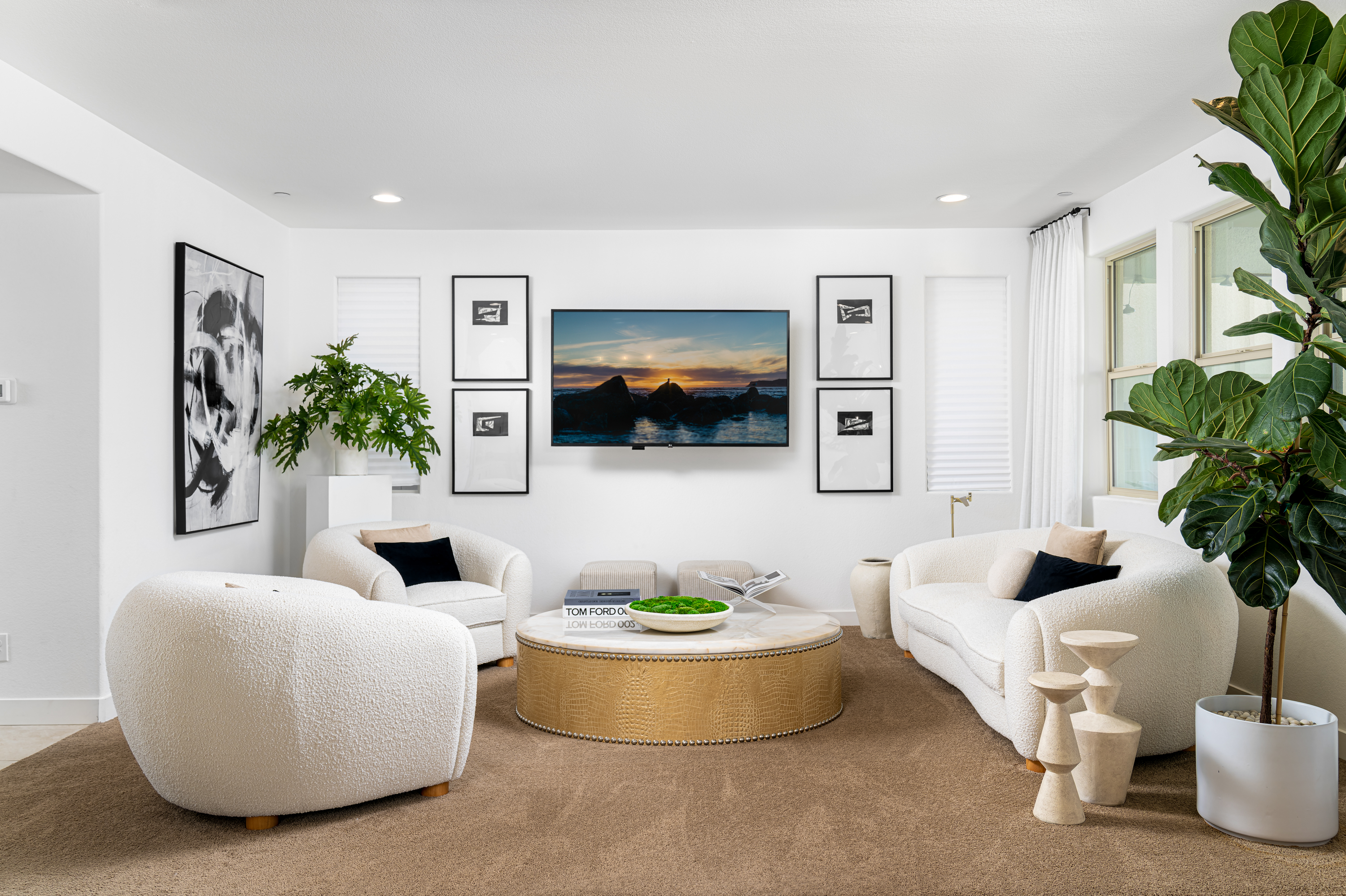 Bedroom at a Stately contemporary minimalist home in Las Vegas (11531 SSS) — oak panel bed, oak nightstand pair, 9-frame abstract gallery wall, brass picture light.