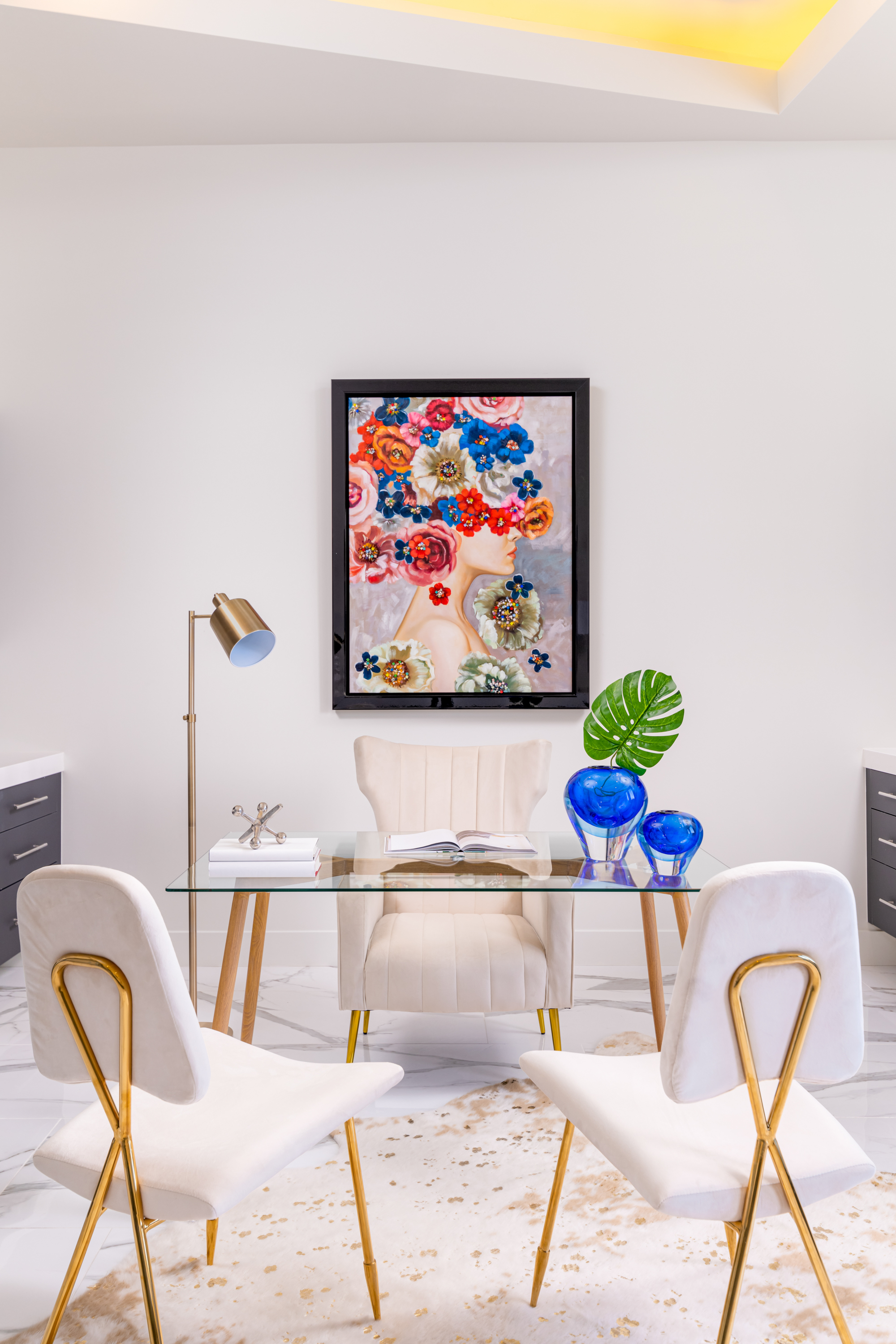 Office at a Stately modern desert resort home in Las Vegas (38 RA) — marble fireplace surround, walnut accent stool, abstract art, palm view.