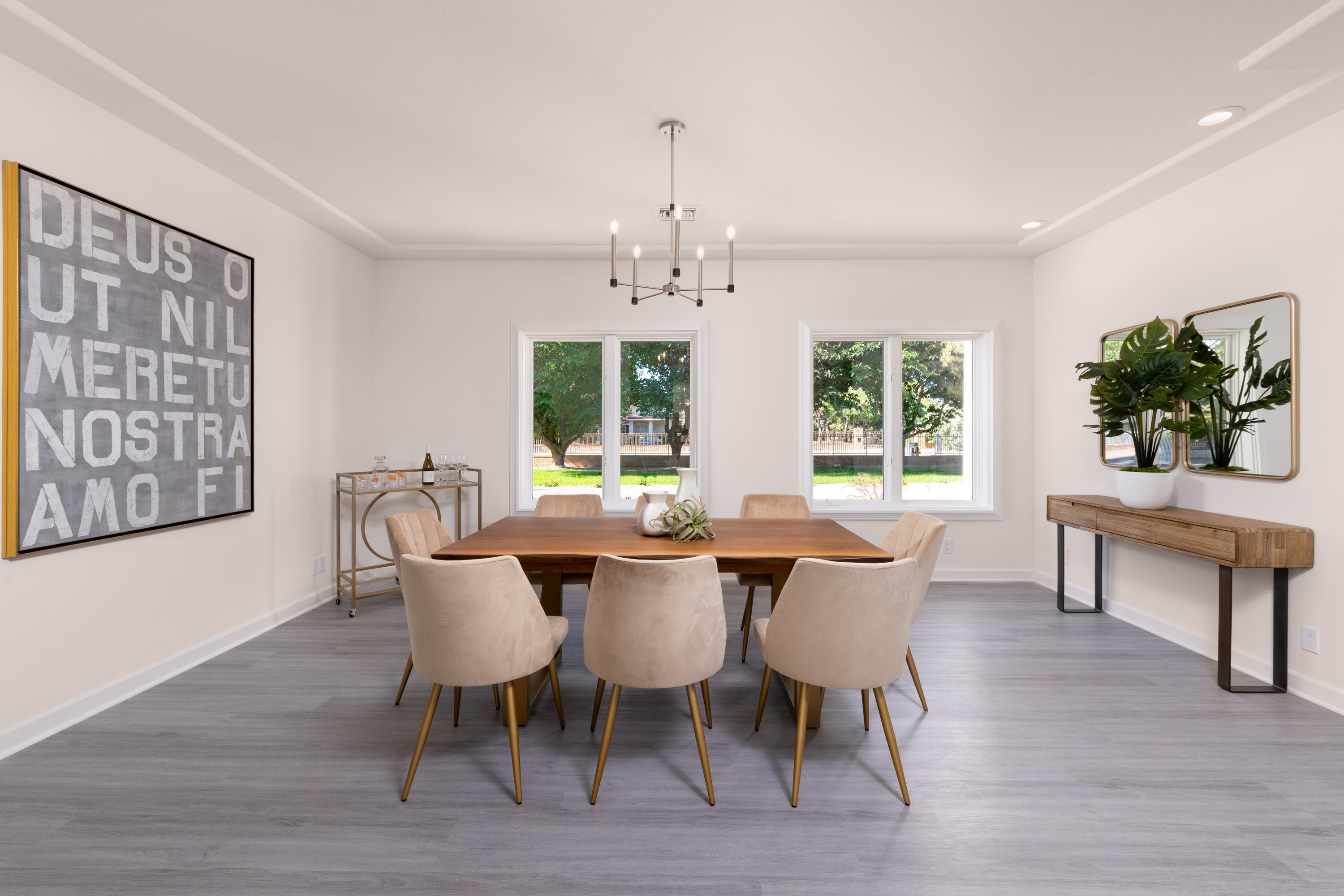 Dining Room at a Stately modern luxury fireplace centerpiece home in Las Vegas (3540 ETL) — herringbone tile fireplace, reclaimed wood drum table, bouclé chairs, arched w